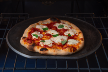 Load image into Gallery viewer, Neapolitan-style pizza with crisp crust cooked in a home oven on a Borough Furnace cast iron pizza griddle.