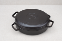 Load image into Gallery viewer, A black cast iron braising skillet with a paired lid, featuring large handles on the sides.