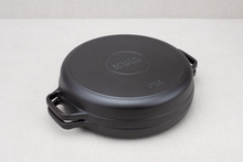 Load image into Gallery viewer, Borough Furnace cast iron grill pan inverted as a braising lid on the 12-inch braising skillet