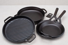 Load image into Gallery viewer, A set of black cookware including a 10.5" frying skillet, a 9" frying skillet, a 12" braising skillet grill pan, and a braising lid with a bottle opener.