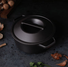 Load image into Gallery viewer, Borough Furnace seasoned cast iron dutch oven in use on a stovetop, oven-safe to 800°F
